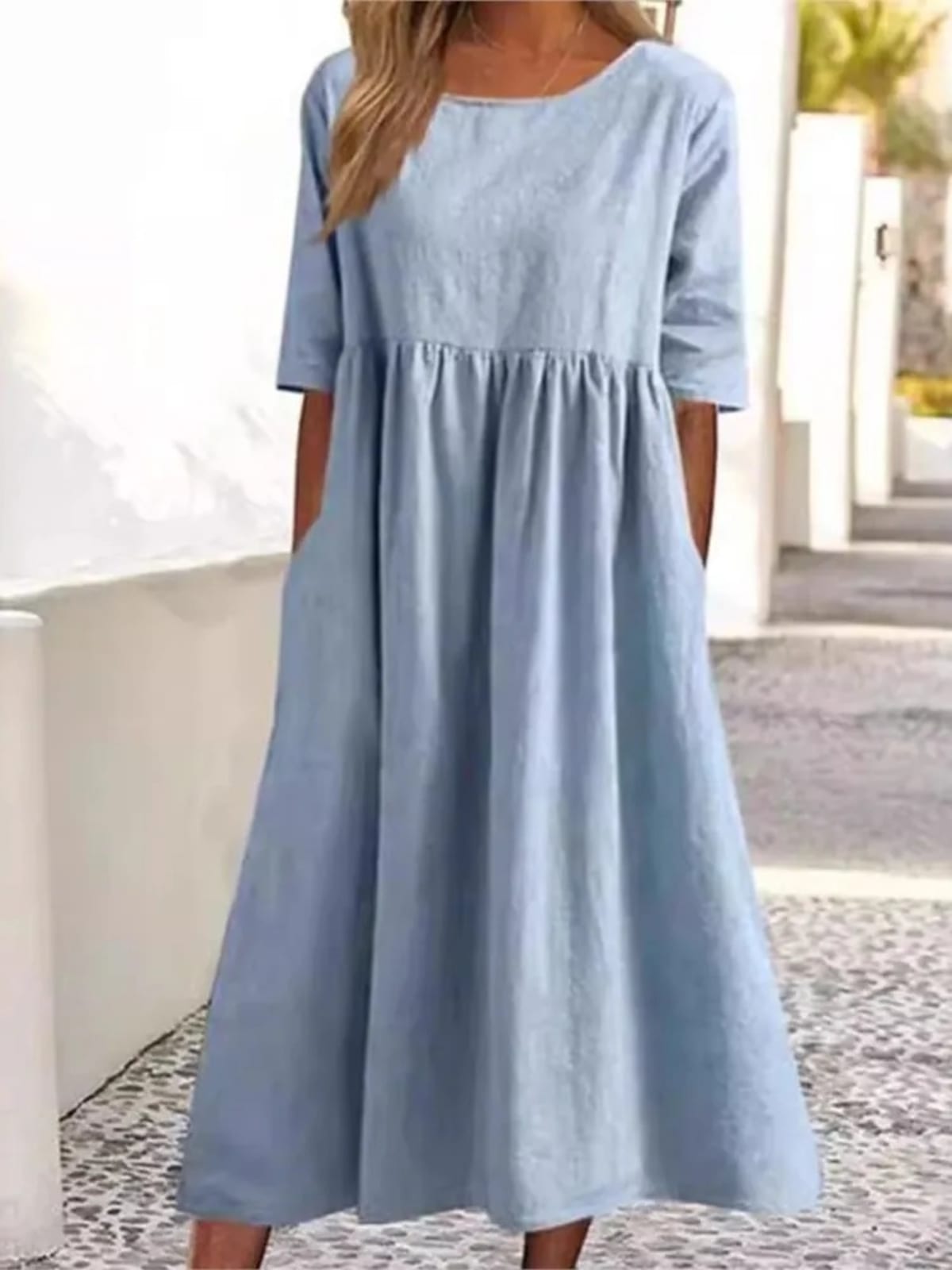 A-line dress with relaxed cut and soft fabric, styled for spring.