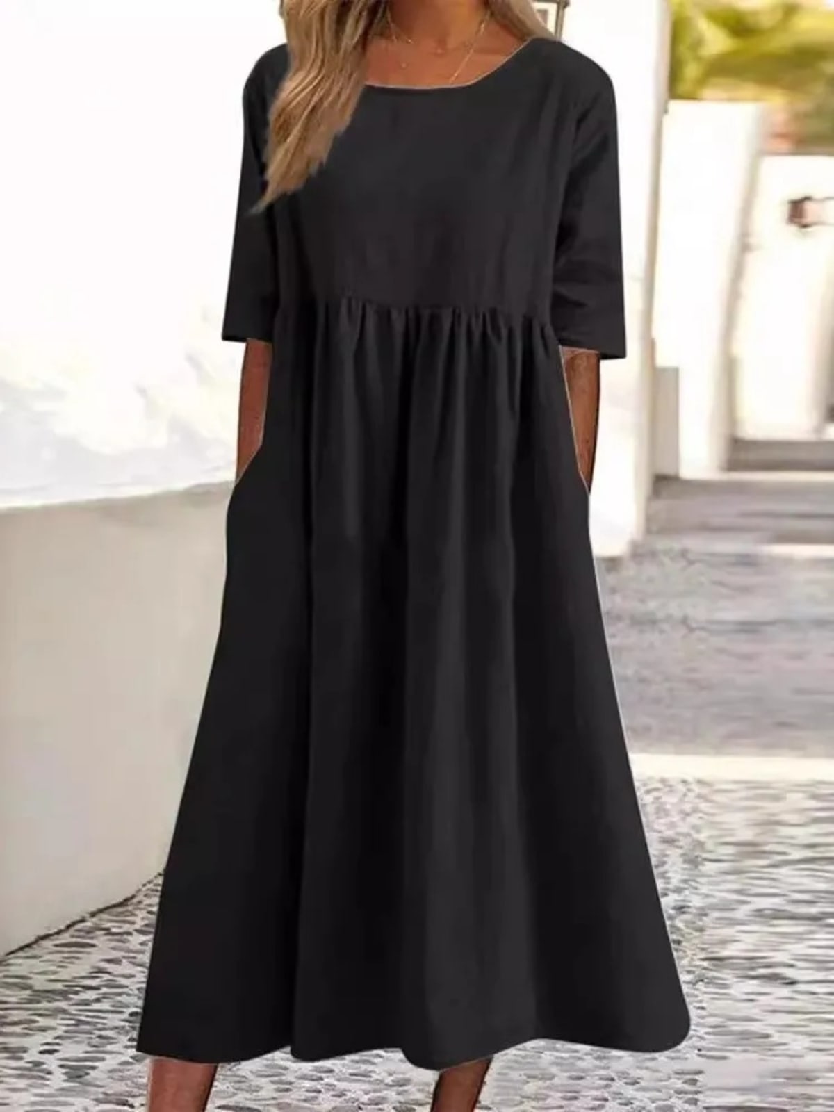 A-line dress with relaxed cut and soft fabric, styled for spring.