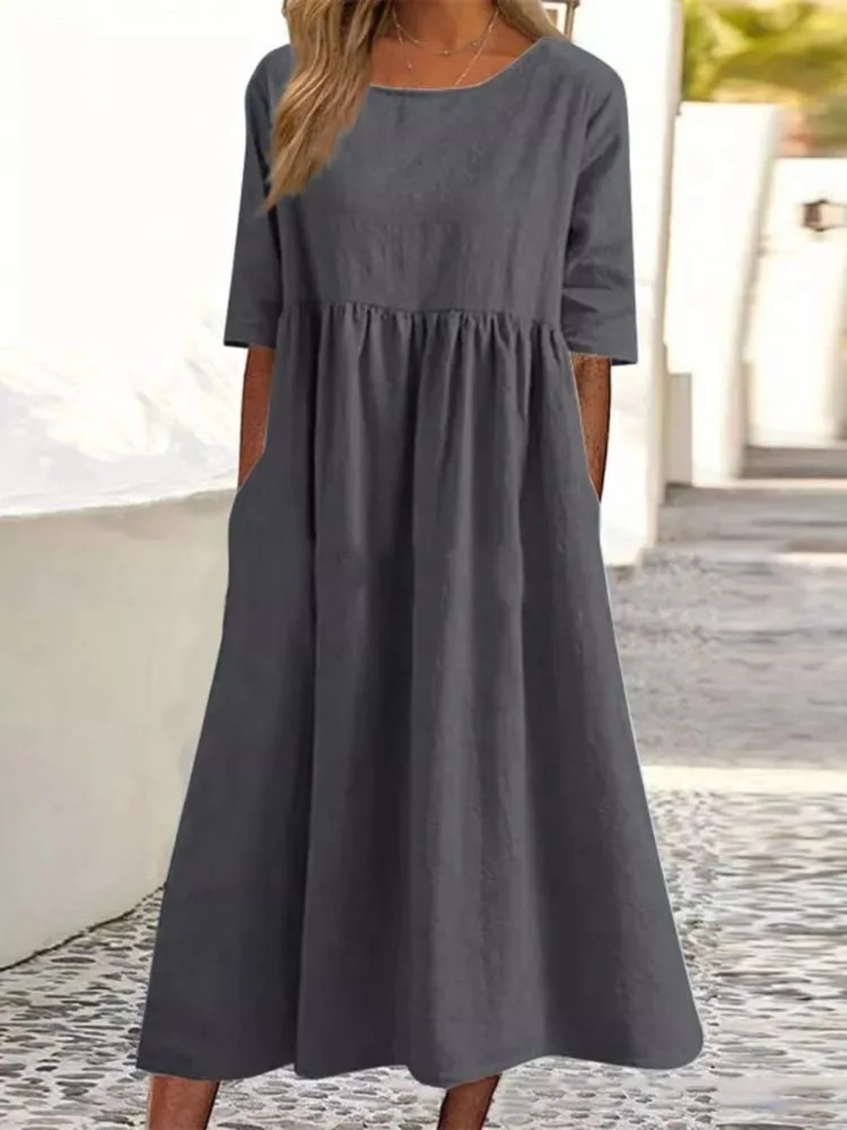 A-line dress with relaxed cut and soft fabric, styled for spring.