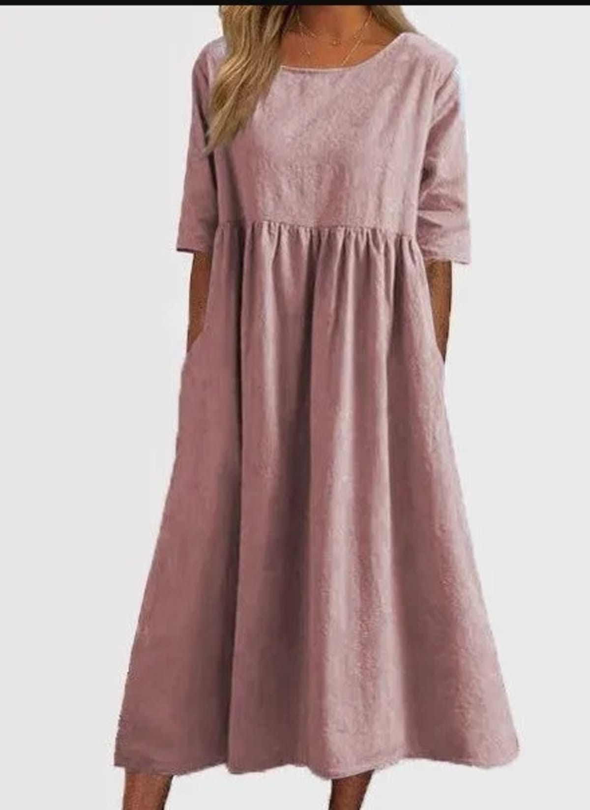 A-line dress with relaxed cut and soft fabric, styled for spring.