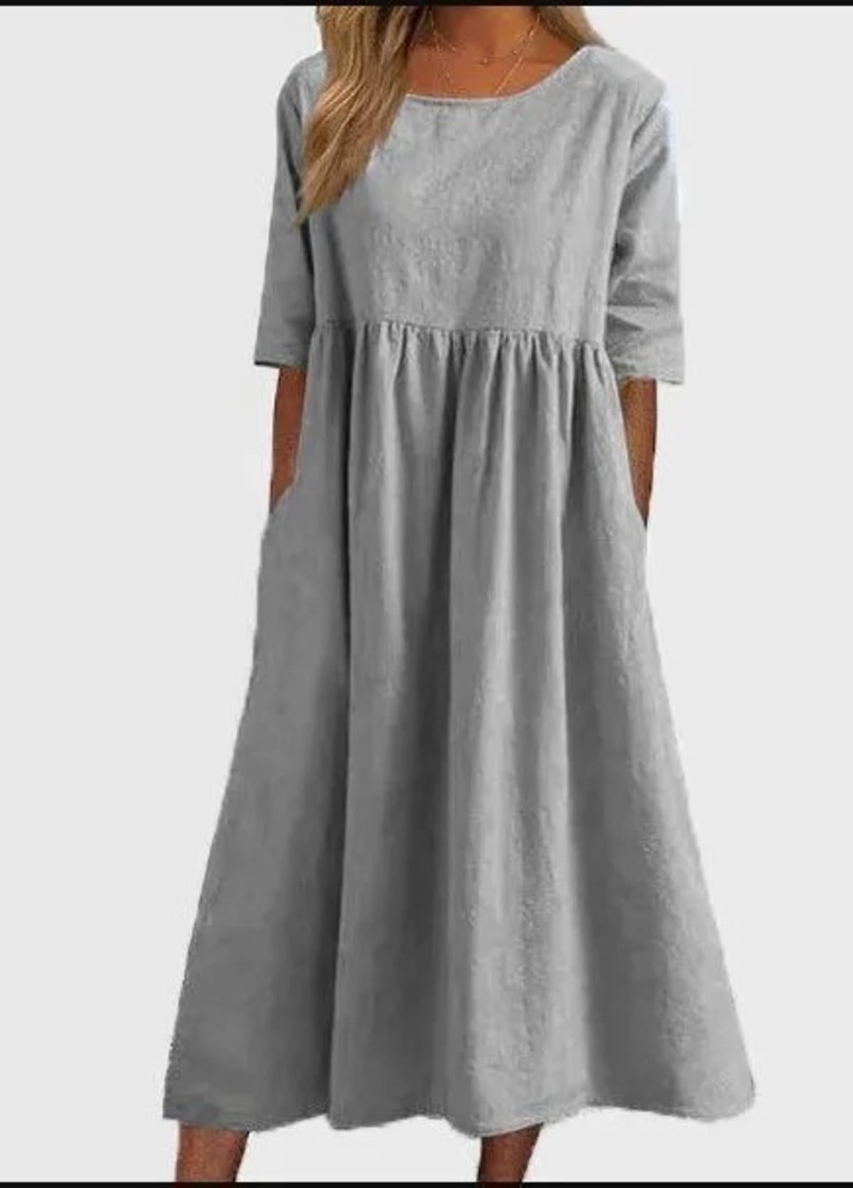 A-line dress with relaxed cut and soft fabric, styled for spring.