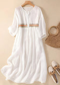 Embroidered midi dress with relaxed silhouette and flowing fit.