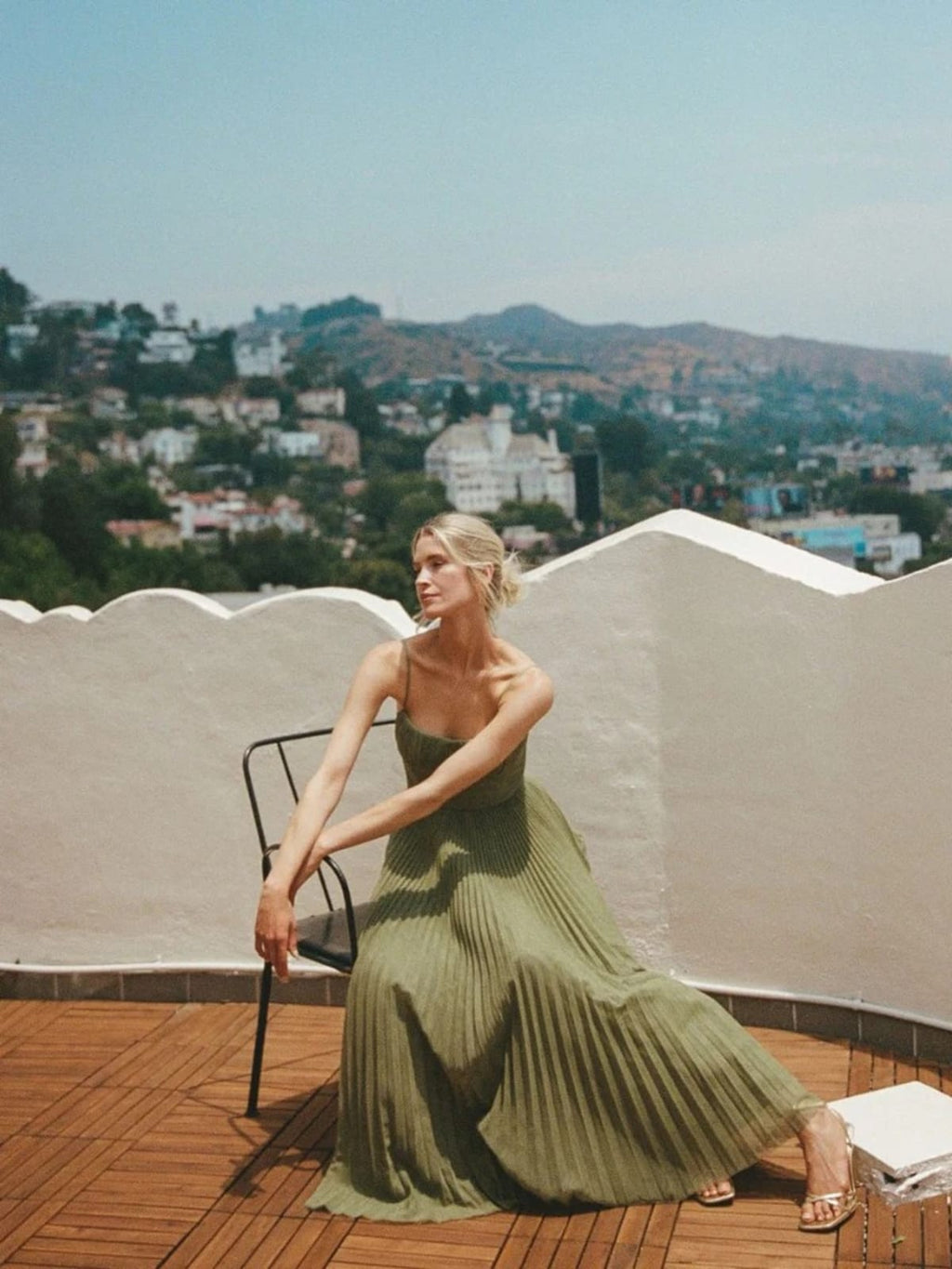 Maxi dress with structured bodice and pleated skirt, sweetheart neckline.