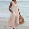 Sleeveless midi dress with front buttons on mannequin.