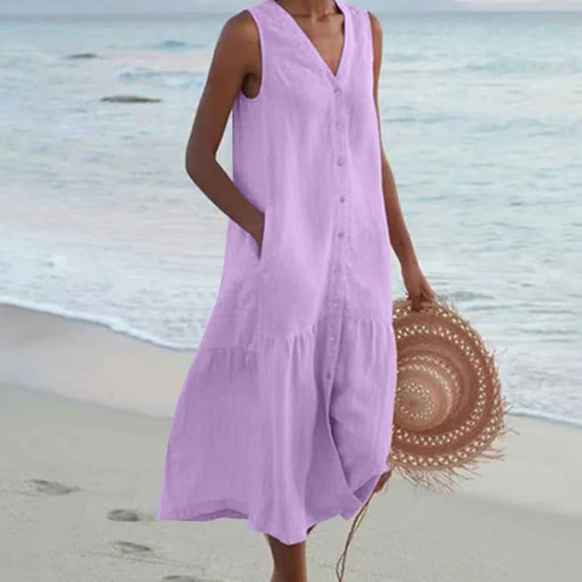 Sleeveless midi dress with front buttons on mannequin.