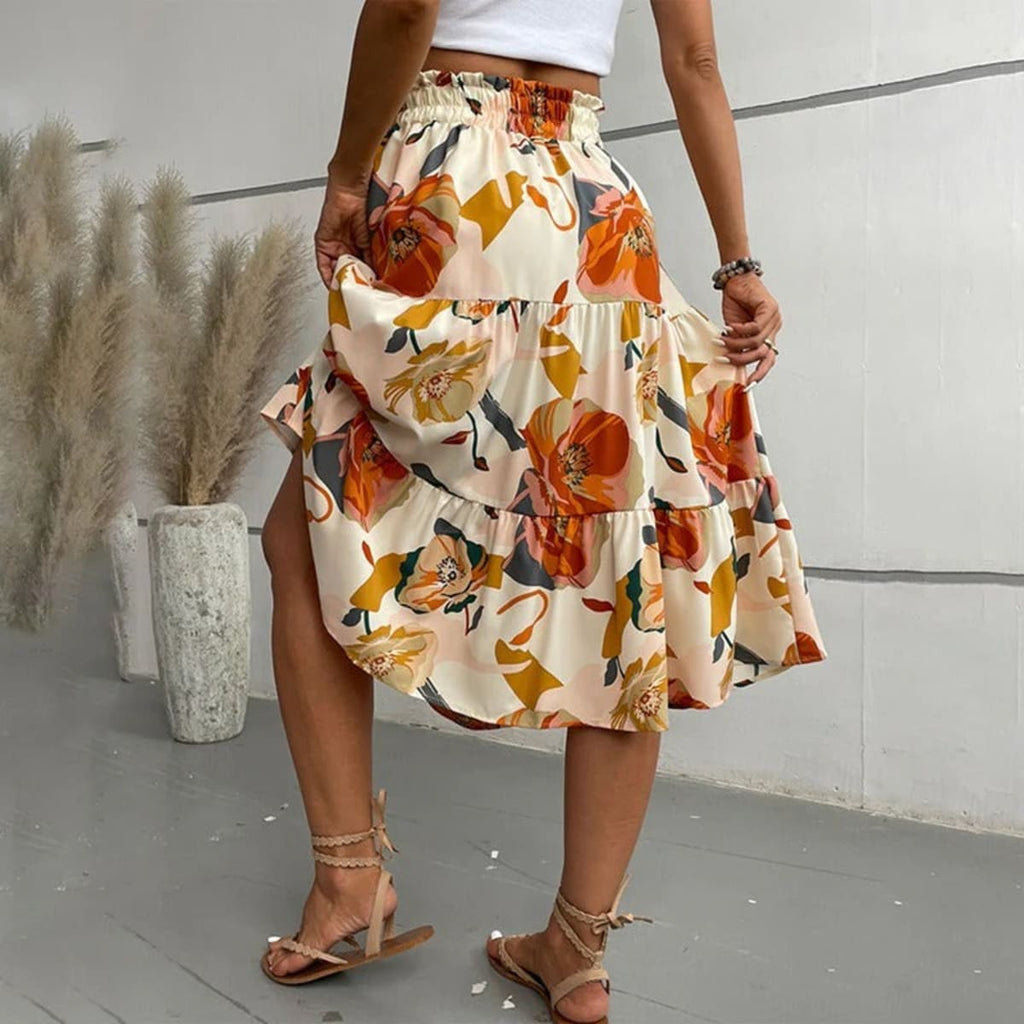 Tiered maxi skirt with vibrant floral print and elastic waist.