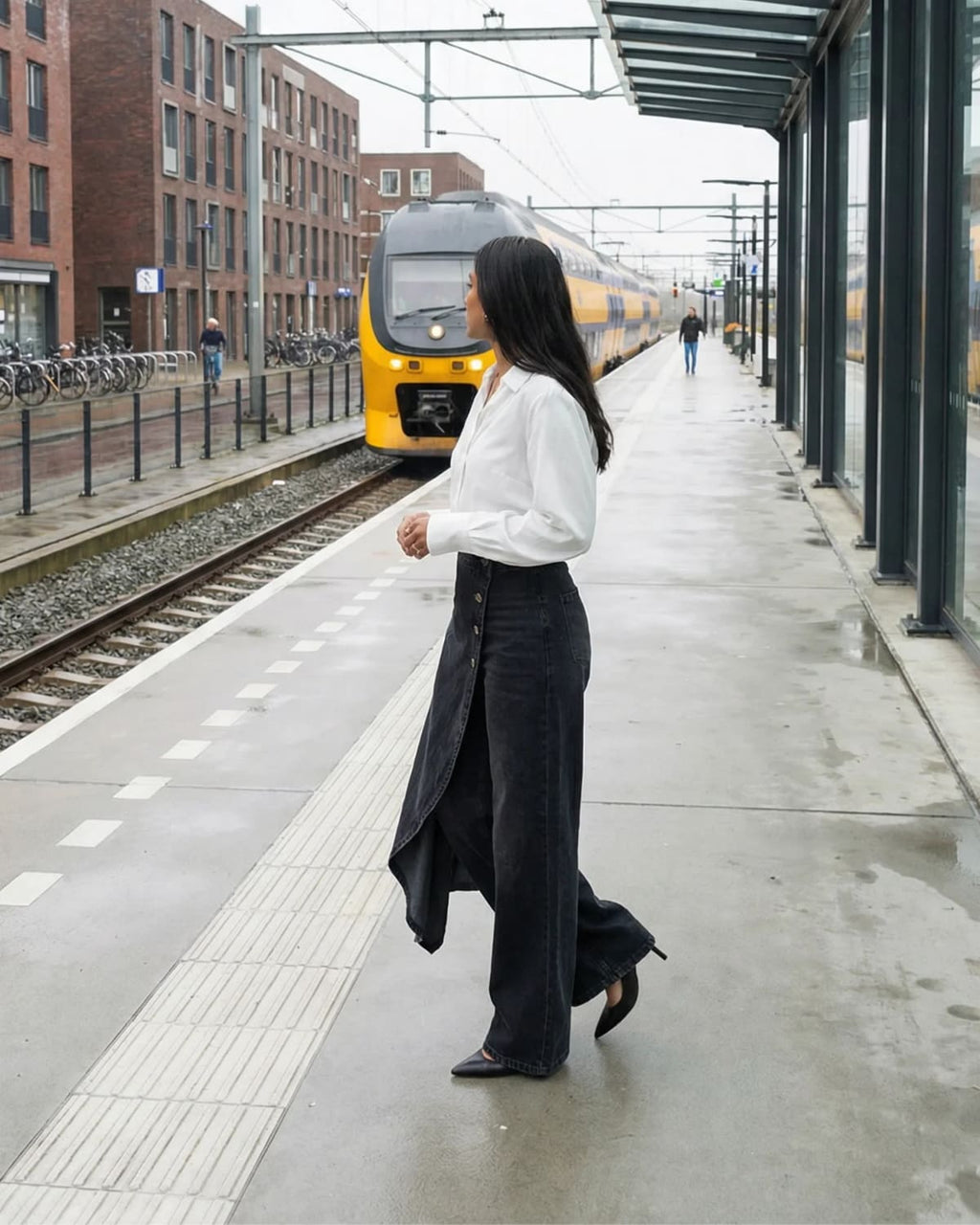 High-waisted wide-leg pants with an asymmetrical wrap front.