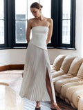 Strapless pleated maxi dress with side split and bandeau bodice.