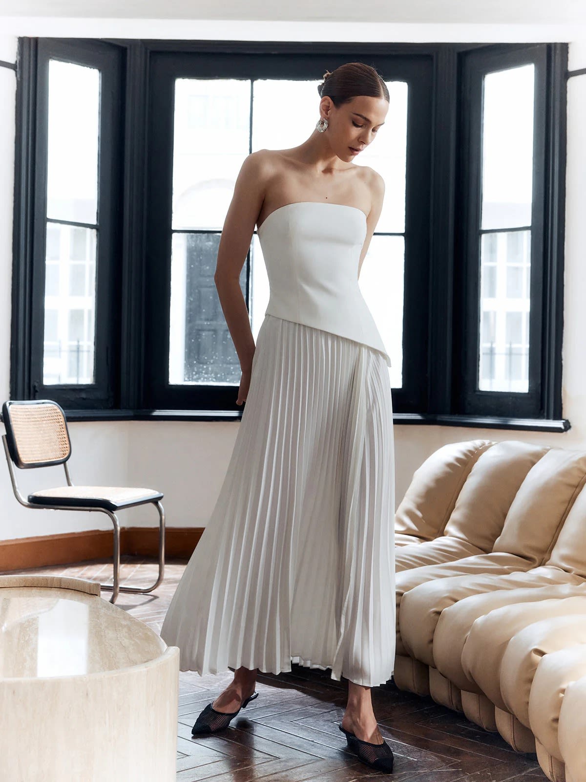 Strapless pleated maxi dress with side split and bandeau bodice.